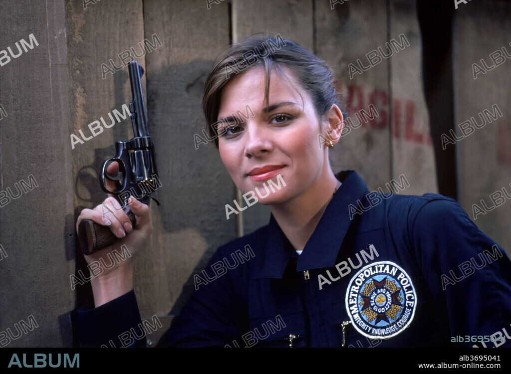 KIM CATTRALL dans POLICE ACADEMY, 1984, réalisé par HUGH WILSON. Copyright WARNER BROS. PICTURES.