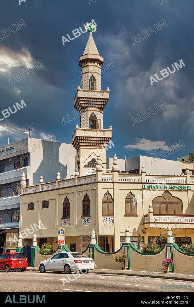 Singapore: Rain clouds behind Khadijah Mosque (Masjid Khadijah) in Geylang Road, Geylang, traditionally a Muslim / Malay quarter of the city. The mosque was completed in 1920, after Puan Khadijah Binte Mohamed donated the value of her property, $50,000, in 1916.