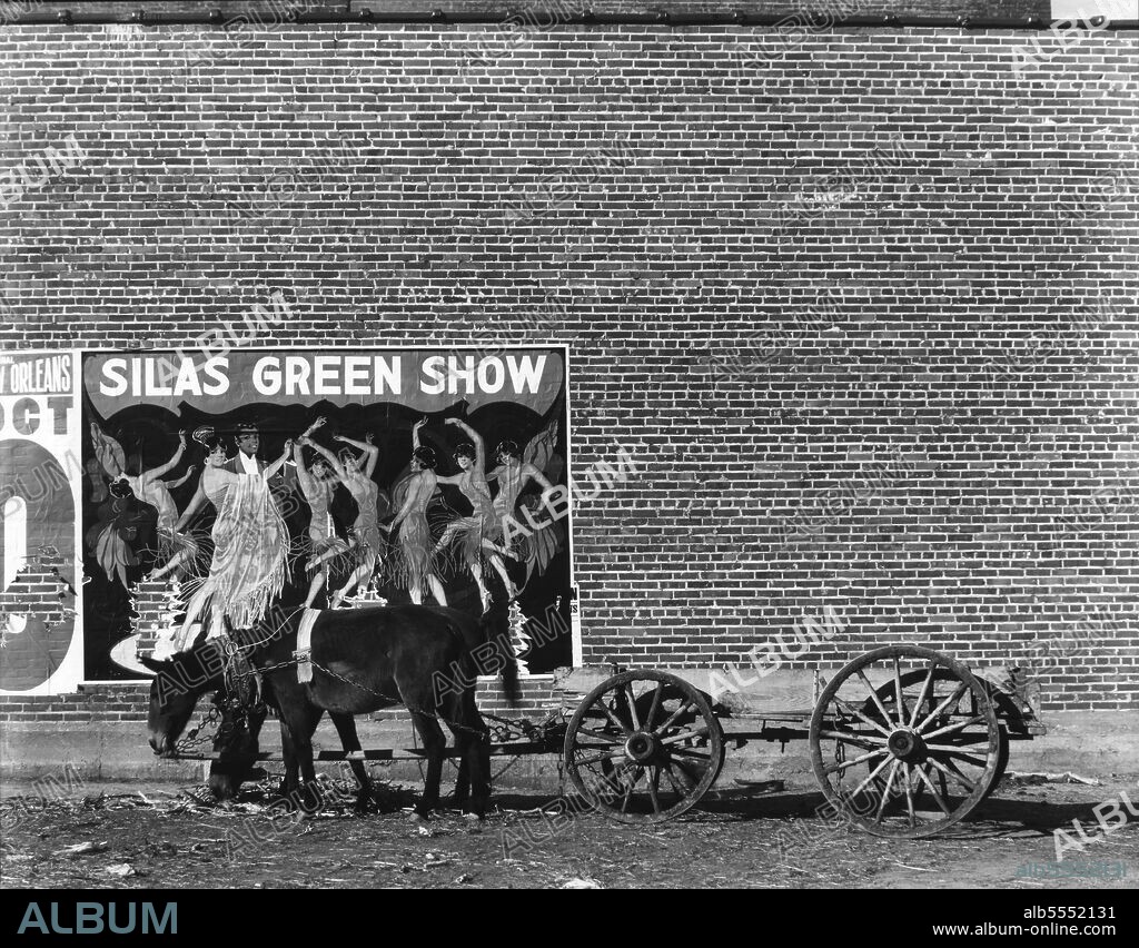 WALKER EVANS. Minstrel poster in Alabama town. ['Silas Green Show'. Silas Green from New Orleans was a touring show - part revue, part musicomedy, part minstrel show - which portrayed black people in a stereotypical manner now considered offensive].