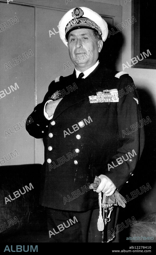 French Admiral Pierre Barjot Stuck a pictureseque pose when he arrived at Mascot to-day by K.L.M. Constellation. Admiral Barjot, who is Commander of the French Naval forces in the Indian Ocean, is here for defence talks with R. A.N. Officers. September 15, 1954.