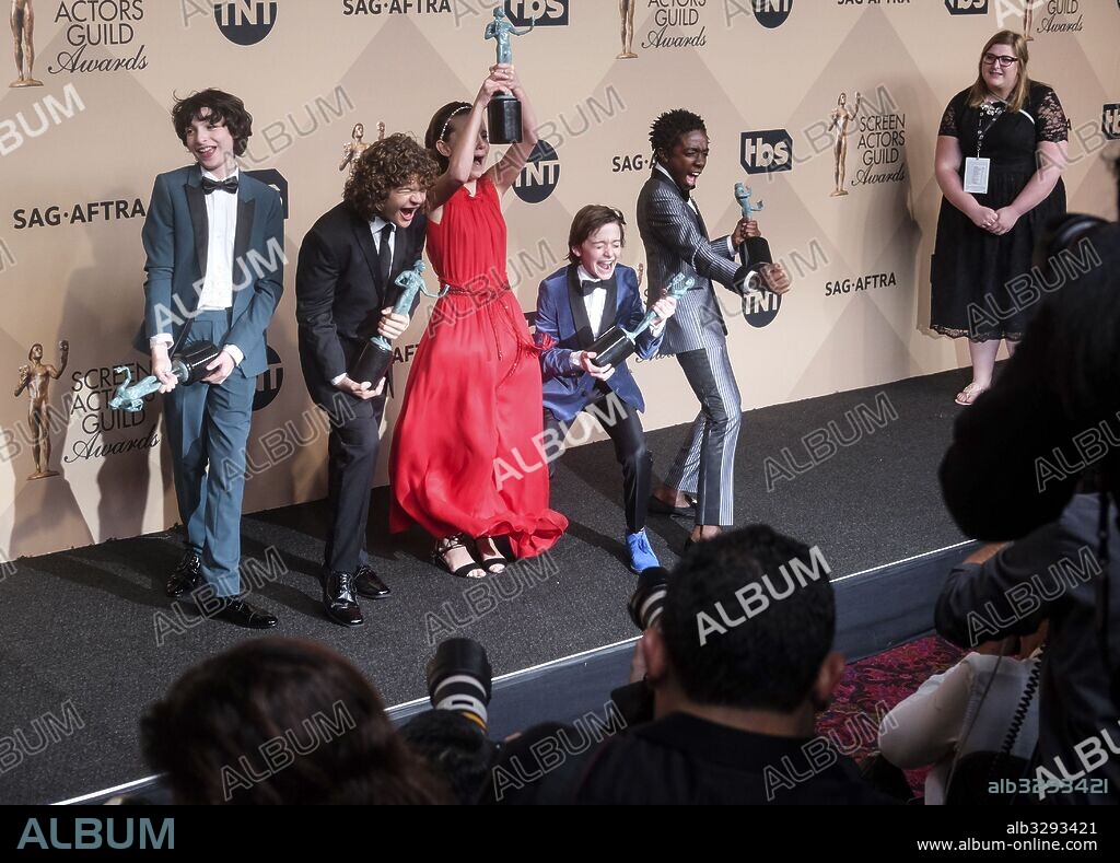 January 29, 2017 - Los Angeles, California, U.S - (L-R) Actors Finn Wolfhard, Gaten Matarazzo, Millie Bobby Brown, Noah Schnapp, and Caleb McLaughlin co-recipients of the Outstanding Performance by an Ensemble in a Drama Series award for 'Stranger Things,' pose in the press room during the 23rd Annual Screen Actors Guild Awards at The Shrine Expo Hall on January 29, 2017 in Los Angeles, California. 29/01/2017