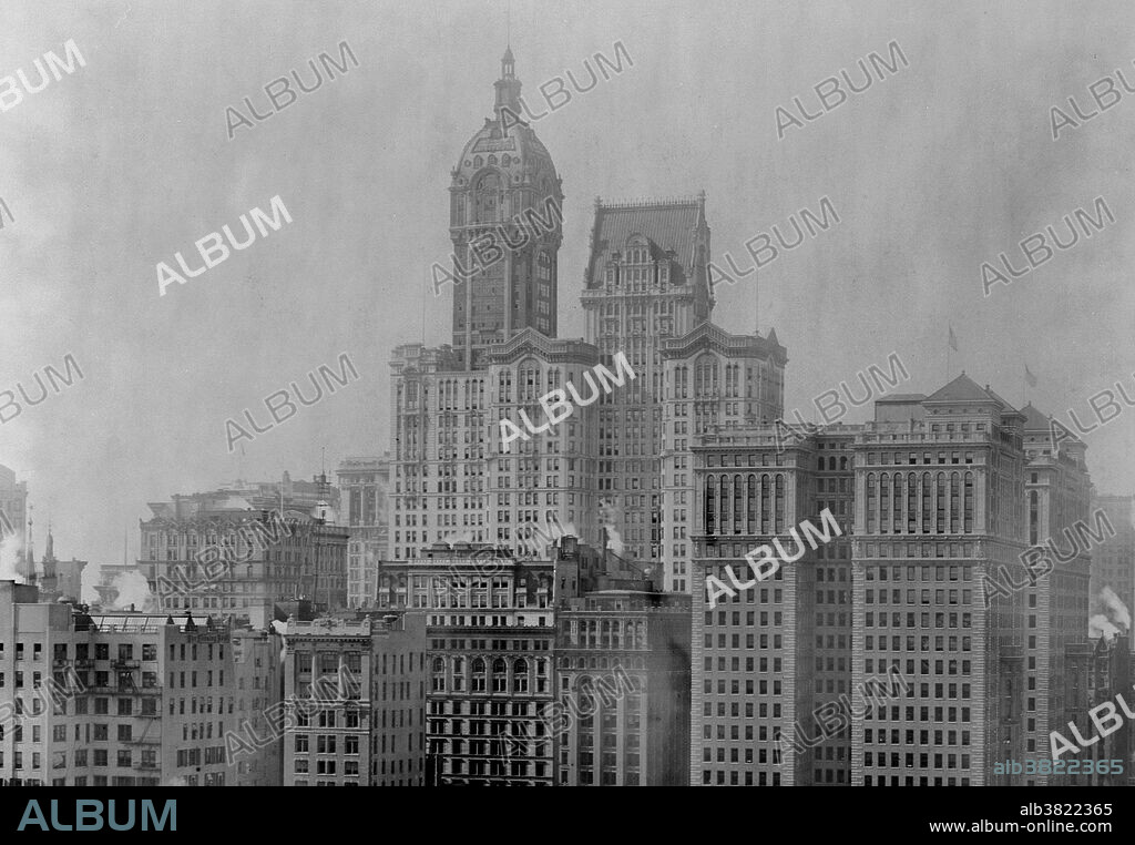 View from the north with the Hudson Terminal (right), Singer Building (middle) and City Investing Building (between). The Singer Building at Liberty Street and Broadway in Lower Manhattan's Financial District, was a 47-story office building completed in 1908 as the headquarters of the Singer Manufacturing Company. The building was commissioned by Frederick Bourne, who hired architect Ernest Flagg, an early exponent of the Beaux-Arts architectural style. The 12 story base of the building filled an entire block front, while the tower above was relatively narrow. The tower floors were squares only 65 feet on a side. It was demolished in 1968, together with the adjacent City Investing Building, and is now the site of 1 Liberty Plaza. When it was demolished, it was the tallest building ever to be demolished, and is still the third-tallest building ever to be destroyed (after the World Trade Center towers) and the tallest to be purposely demolished by its owner. Photographed by Irving Underhill, 1909.