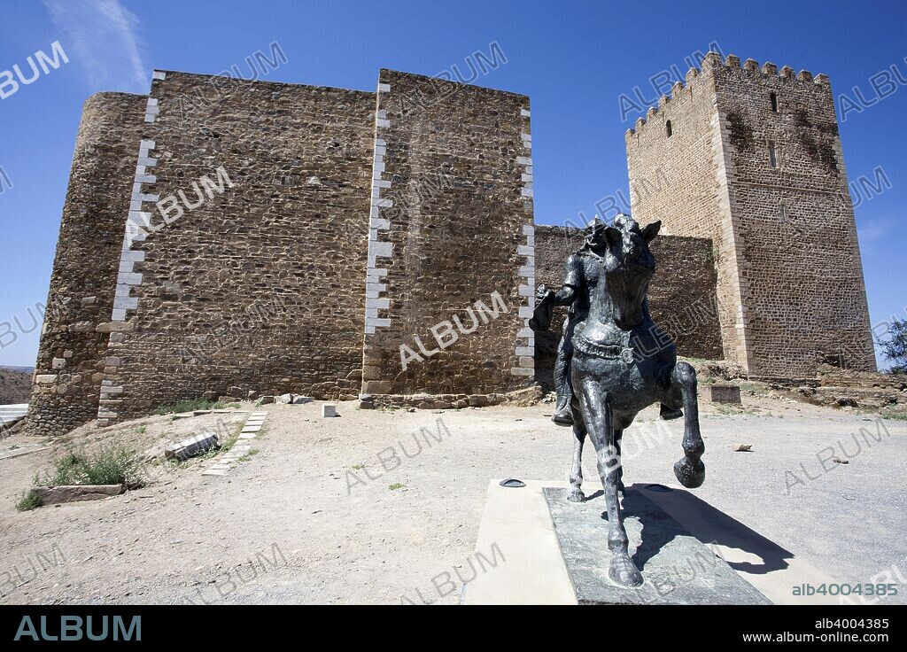 Statue of Ibn Qasi, Lord of Mertola, outside Mertola Castle, Mertola, Portugal, 2009. Ibn Qasi was a mystic and skilled military leader who unified Southern Portugal and fought the power of the Almoravides in the 12th century. The castle of Mertola is located on the highest point of the village. Even though the castle is of Muslim origin, the current building dates from a reconstruction carried out by the knights of the Order of Santiago after the village was taken by the Christians. The most notable feature of the castle is its 30 metre-high keep tower, finished around 1292, which has an inner hall covered with Gothic vaulting. The defences include a city wall, which still encircles the village.