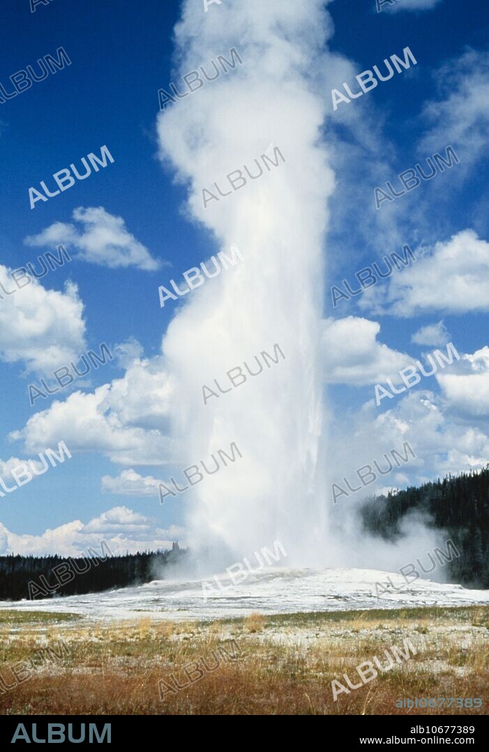 Old Faithful. View of the world's most famous geyser erupting. Geysers (Icelandic "geysir" = gusher) consist of deep wells in geothermal rock fissures. Somewhere near the base of the well is a large chamber. The water in the chamber is heated by the surrounding rocks until it is well over normal boiling point, but is prevented from boiling by hydrostatic pressure. The heating also causes the water to expand, spilling from the lip of the well. At a critical point, the decreasing hydrostatic pressure allows the superheated water to boil spontaneously and erupt. Old Faithful is in Yellowstone National Park, USA.