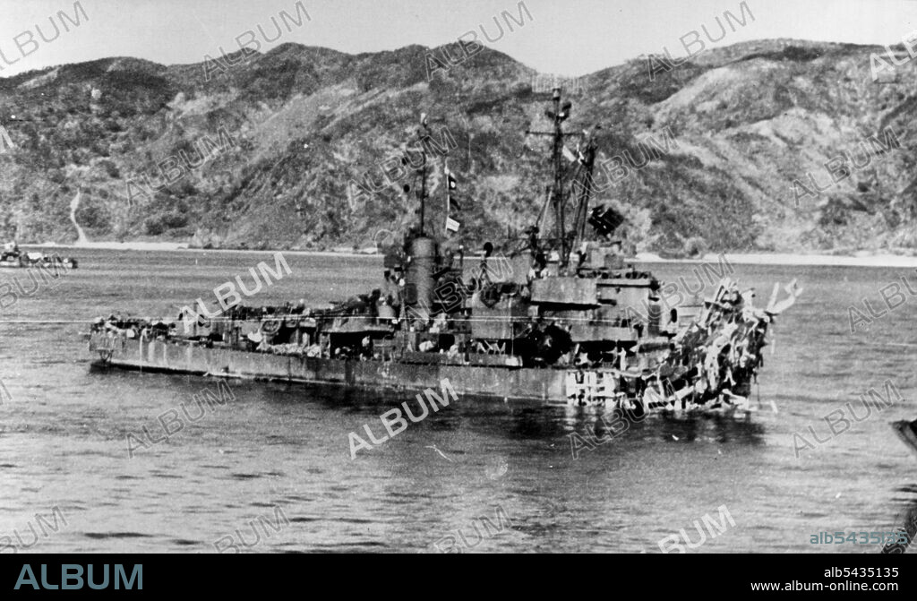 Shakes Off Twin Suicide Attack Okinawa -- Twice hit by suicide planes in action near Mae Shima off Okinawa on April 12, 1945, the minelayer USS Lindsey stayed afloat despite loss of more than 60 feet of bow and forward hull section. With front half of ship twisted beyond recognition, the Lindsey plows her way through the water shortly after attack fifty men were killed and 57 wounded in twin attacks. July 9, 1945. (Photo by ACME).