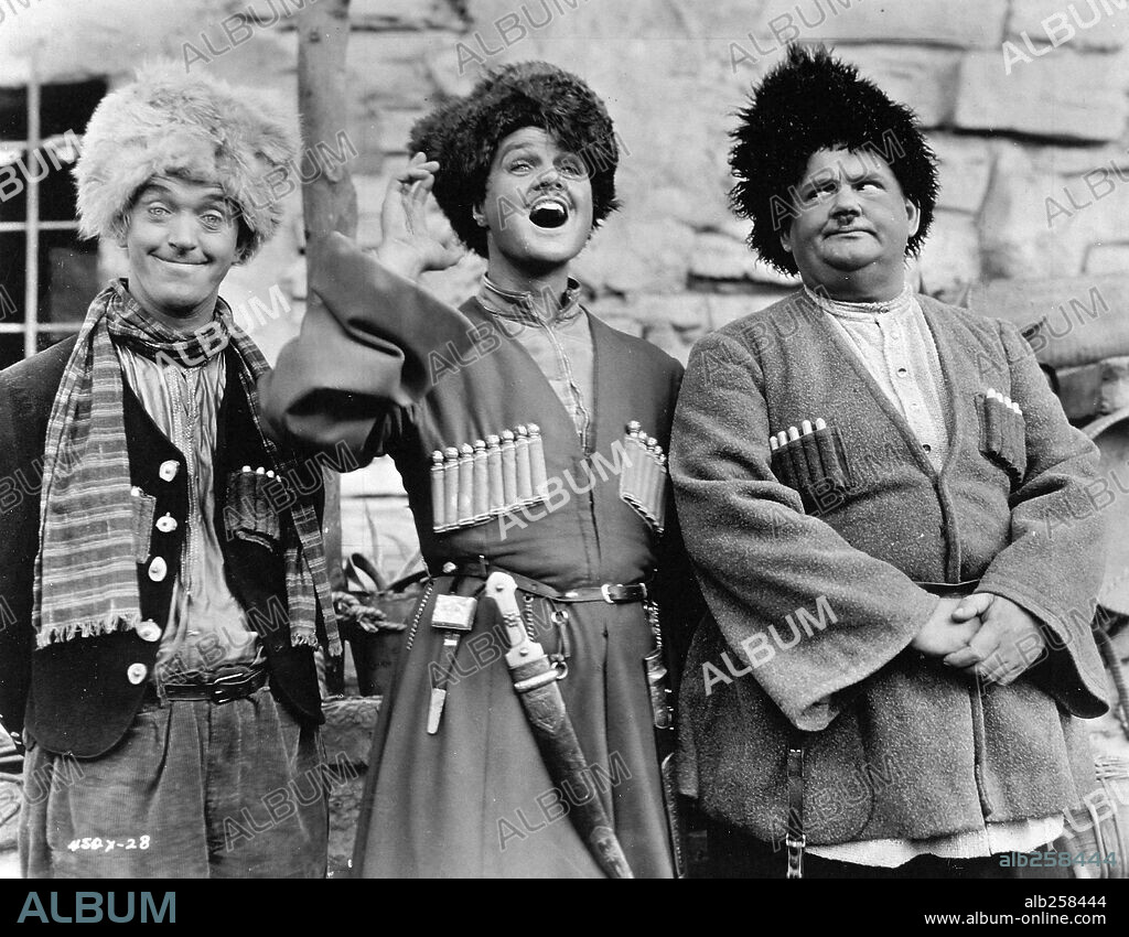 LAWRENCE TIBBETT, OLIVER HARDY and STAN LAUREL in THE ROGUE SONG, 1930, directed by LIONEL BARRYMORE. Copyright M.G.M.