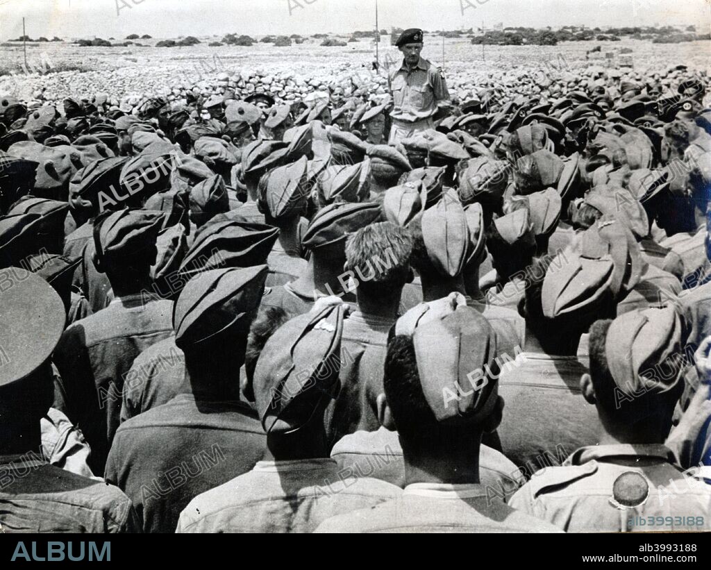 British General Bernard Montgomery addressing his troops, North Africa, World War II, c1942-c1943. Bernard Law Montgomery (1887-1976) was given command of the British and Commonwealth forces of the 8th Army in August 1942 and two months later led them to victory over the Germans at El Alamein, the first major British success of the War and a battle that turned the tide of the war in North Africa in favour of the Allies. Knighted and promoted to full General, 'Monty' as he was nicknamed, then commanded British forces in the invasion of Sicily and the Italian mainland. In 1944 he was one of the main architects of the plans for the invasion of Normandy and commanded the Allied ground forces on D-Day and for several months afterwards. Friction between Montgomery and the American commanders, together with the growing numerical disparity between the US and British components of the Allied forces led to his replacement as commander late in 1944, promotion to the rank of Field Marshal being awarded as compensation.