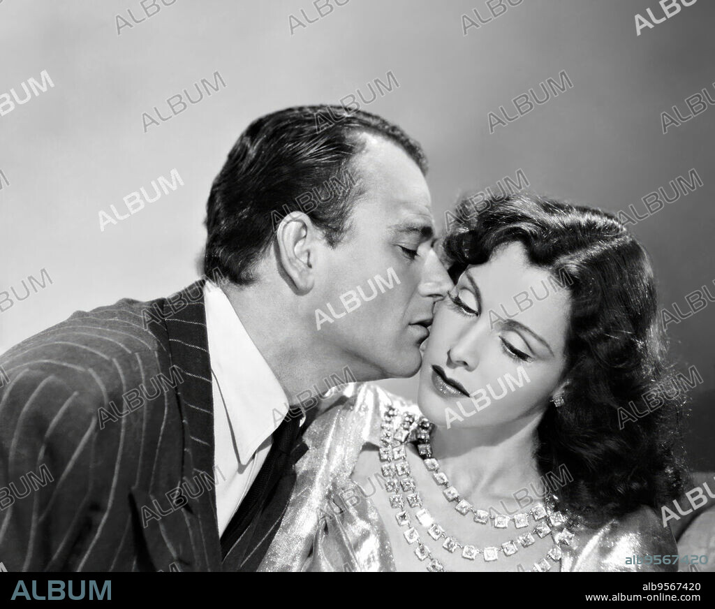 FRANCES DEE and JOHN WAYNE in A MAN BETRAYED, 1941, directed by JOHN H. AUER. Copyright REPUBLIC PICTURES.