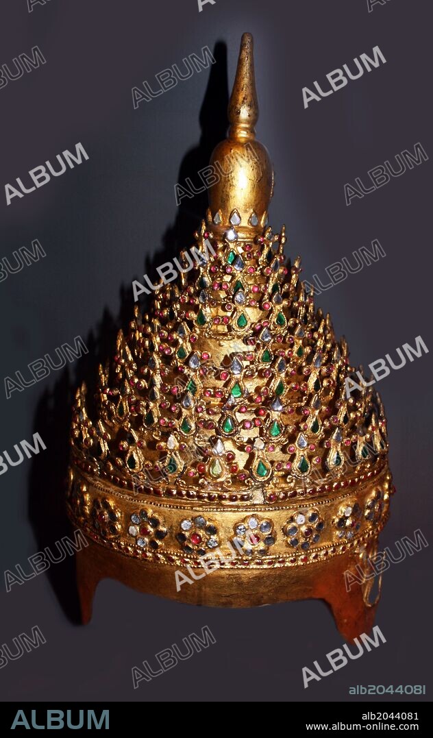 Theatrical Headdress 1800-80 Konbaung period. Burma. Lacquer, wood and sheet metal, gilded and inlaid with pieces of glass.