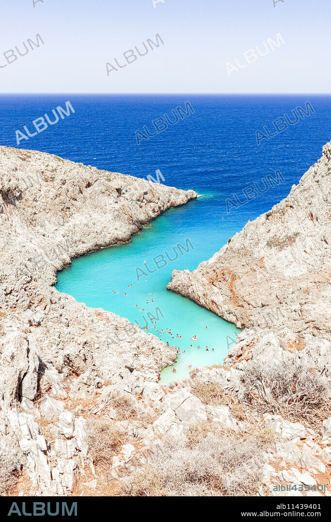 Beach of Seitan Limania washed by turquoise sea nestled inside rock canyons, Akrotiri peninsula, Chania, Crete, Greek Islands, Greece, Europe.