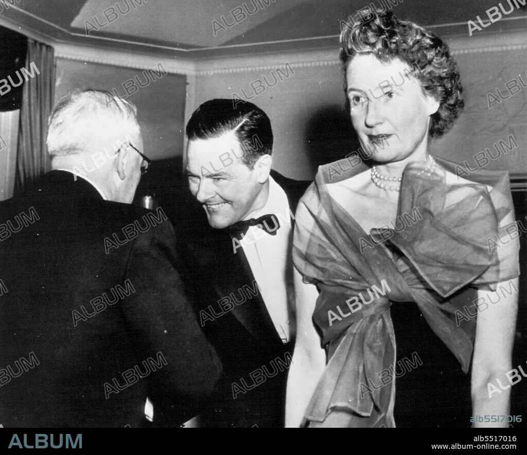 I Greet You, Sir -- Henry Cabot Lodge Jr. (facing camera), chief United States delegate to the United Nations, smiles and shakes hands with Andrei Y. Vishinsky, top Soviet U.N. delegate, at dinner here tonight for U.N. personnel given by Vishinsky in his capacity as chairman of the Security Council. Earlier this year Lodge, after taking over as chief U.S. delegate, refused to shake hands with his Russian counterpart. At right is Mrs. Lodge. April 29, 1953. (Photo by AP Wirephoto).