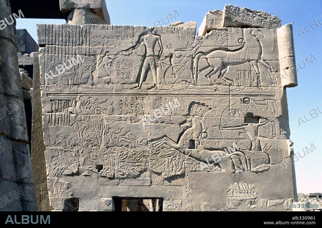 Relief of Battle of Kadesh showing Pharaoh Rameses II in chariot fighting Hittite enemy of King Muwatallis, 1294 BC. Karnak Luxor Egypt.
