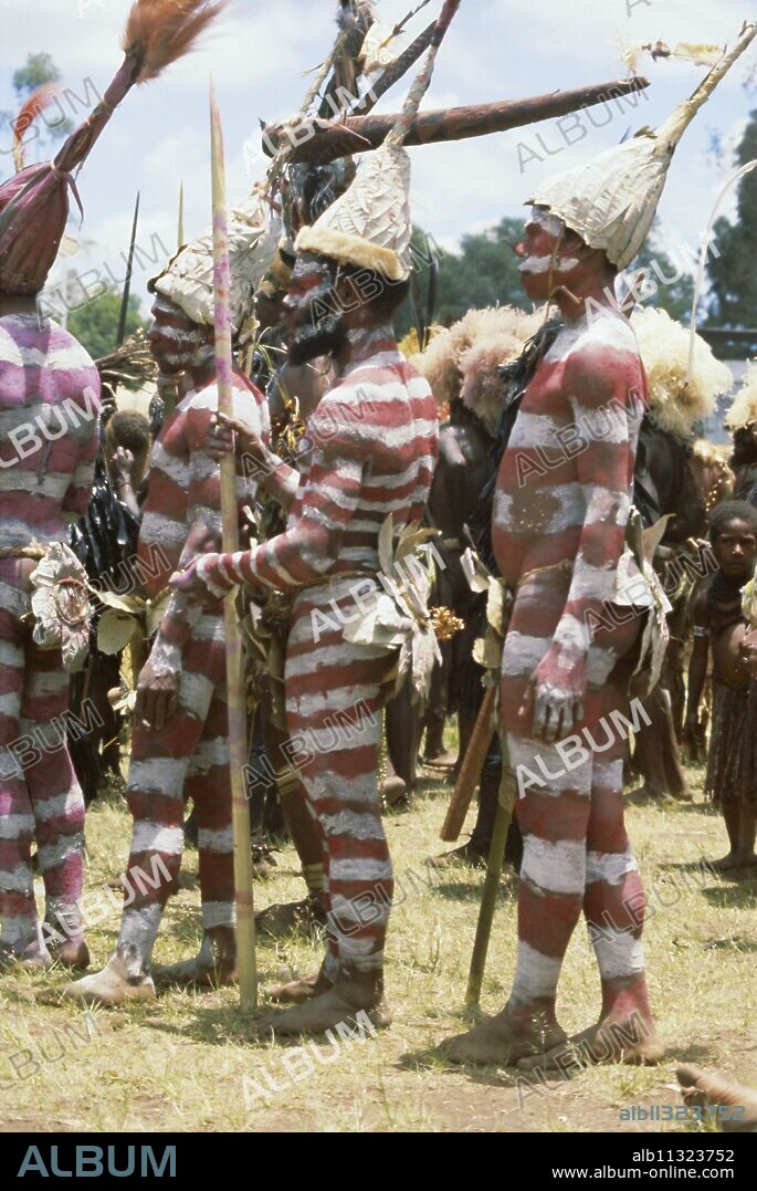Northern Highlands tribesmen with striped body decoration, Goroka, Papua New Guinea, Pacific.