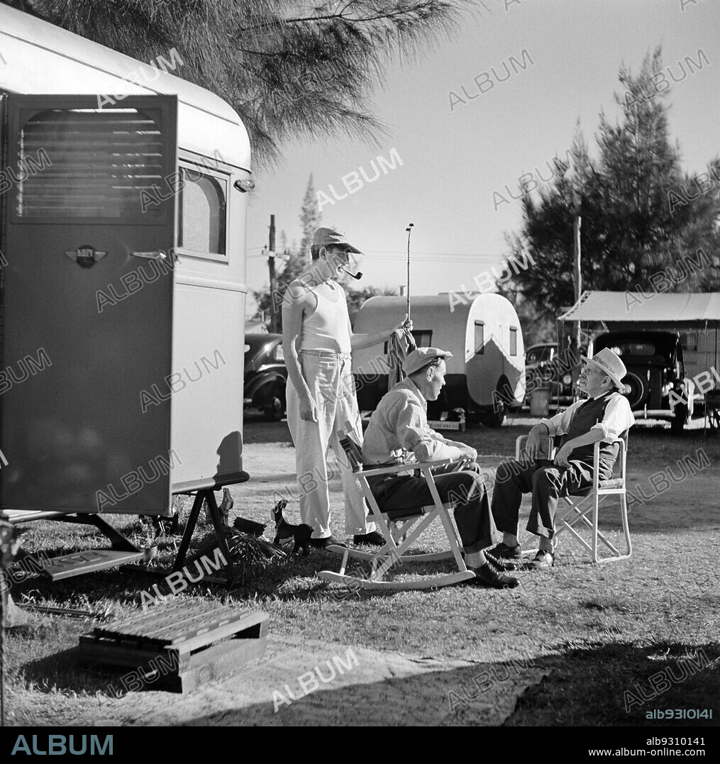 Three Men having Conversation at Trailer Park, Sarasota, Florida, USA, Marion Post Wolcott, U.S. Farm Security Administration, January 1941.