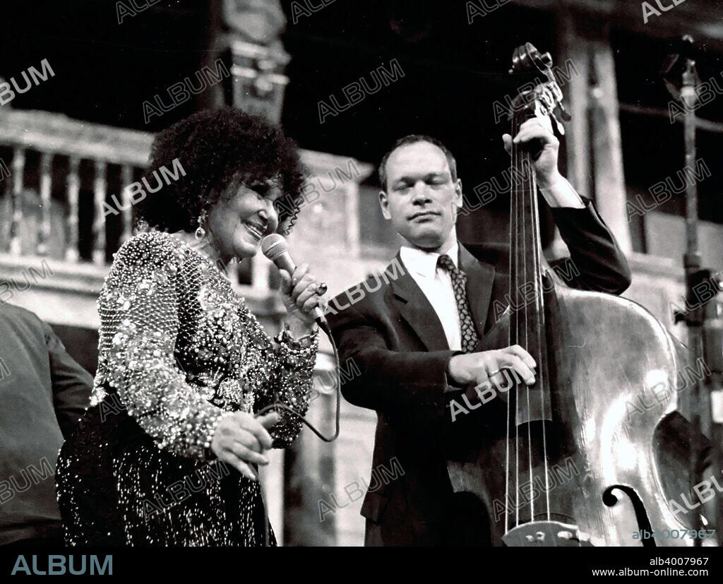 Alec Dankworth, jazz bassist and composer with his mother Dame Cleo Laine, jazz singer and actress, at The Globe, London, 2000. Alec Dankworth's father is the late Sir John Dankworth, jazz composer, saxophonist and clarinetist.
