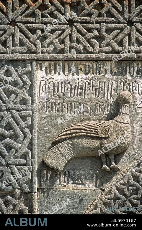 Geghard (Kotajk Province, Republic of Armenia), Geghard (cave monastery) founded in the 4th C. by Gregory the Illuminator.-Kathoghike (Holy Mohter of God Church); built c.1215).-Partial view of the south portal, relief with decorative border, dove and inscription.-Photo, 2007.