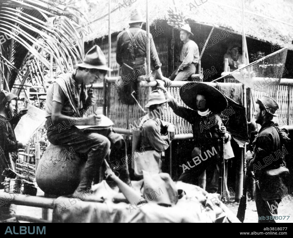 Entitled: "Native Filipino hut serves as quarters for this group of U.S. soldiers." The Philippine-American War (1899-1902) was an armed conflict between the United States and Philippine revolutionaries. The conflict arose from the struggle of the First Philippine Republic to secure independence from the United States following the latter's acquisition of the Philippines from Spain after the Spanish-American War. The war was a continuation of the Philippine struggle for independence that began in 1896 with the Philippine Revolution. Fighting erupted between United States and Philippine revolutionary forces on February 4, 1899, and quickly escalated into the 1899 Second Battle of Manila. On June 2, 1899, the First Philippine Republic officially declared war against the United States. The war officially ended on July 4, 1902. The war and occupation by the U.S. would change the cultural landscape of the islands, as people dealt with an estimated 34,000 to 220,000 Philippine casualties (with more civilians dying from disease and hunger brought about by war), disestablishment of the Roman Catholic Church in the Philippines, and the introduction of the English language in the islands as the primary language of government, education, business, industrial and increasingly in future decades among families and educated individuals. Cropped stereograph card photographed by Keystone View Company, undated.