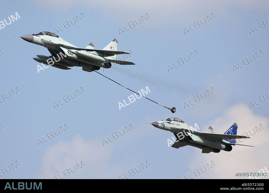 MiG-29K and MiG-35 jet fighters of Russian Air Force performing demonstration flight during MAKS-2011 airshow, Zhukovsky, Russia.