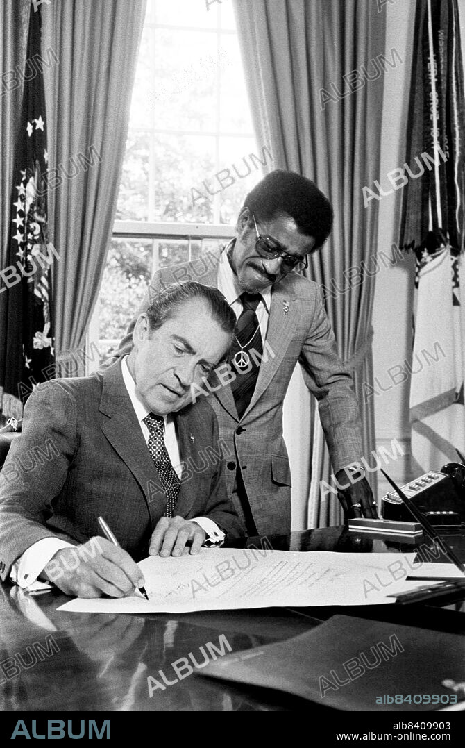 U.S. President Richard Nixon with Entertainer Sammy Davis, Jr., new member of Nat'l. Advisory Council on Economic Opportunity, White House, Washington, D.C., USA, Marion S. Trikosko, U.S. News & World Report Magazine Photograph Collection, July 1971.