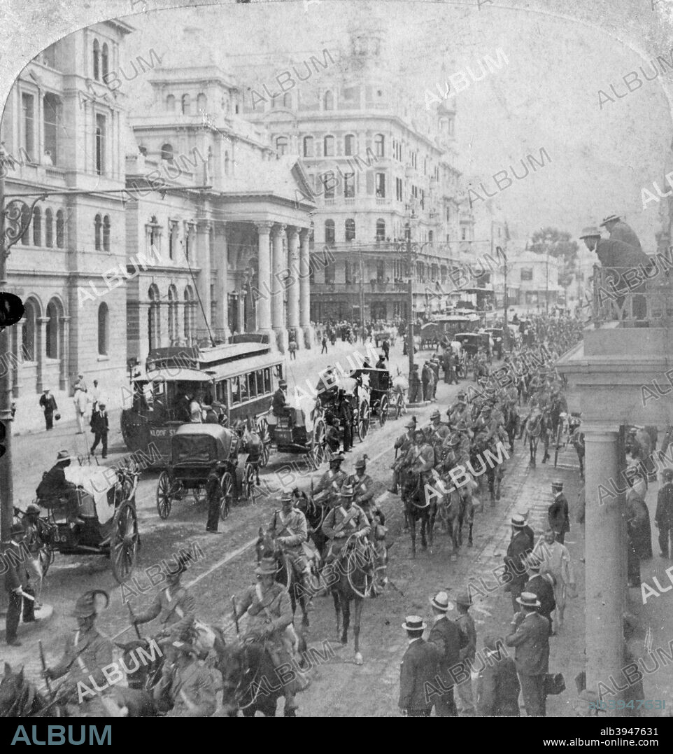 South African Light Horse, Cape Town, South Africa, 2nd Boer War, 1900. Men of the South African Light Horse coming down Adderley Street getting ready to entrain for the front. The South African Light Horse was a volunteer unit of South African cavalry that fought on the British side during the conflict. Stereoscopic card. Detail.
