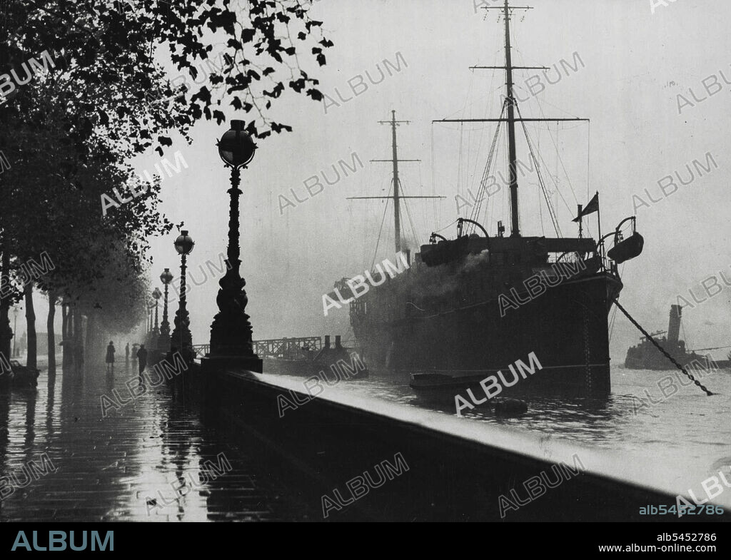 Thames Tide Level -- The naval training ship. President", riding on the high tide at *****.Authorities are keeping a strict watch on the Thames high tide in case of flooding owing to the heavy rainfall of the past fortnight. November 01, 1932. (Photo by Sport & General Press Agency, Limited).