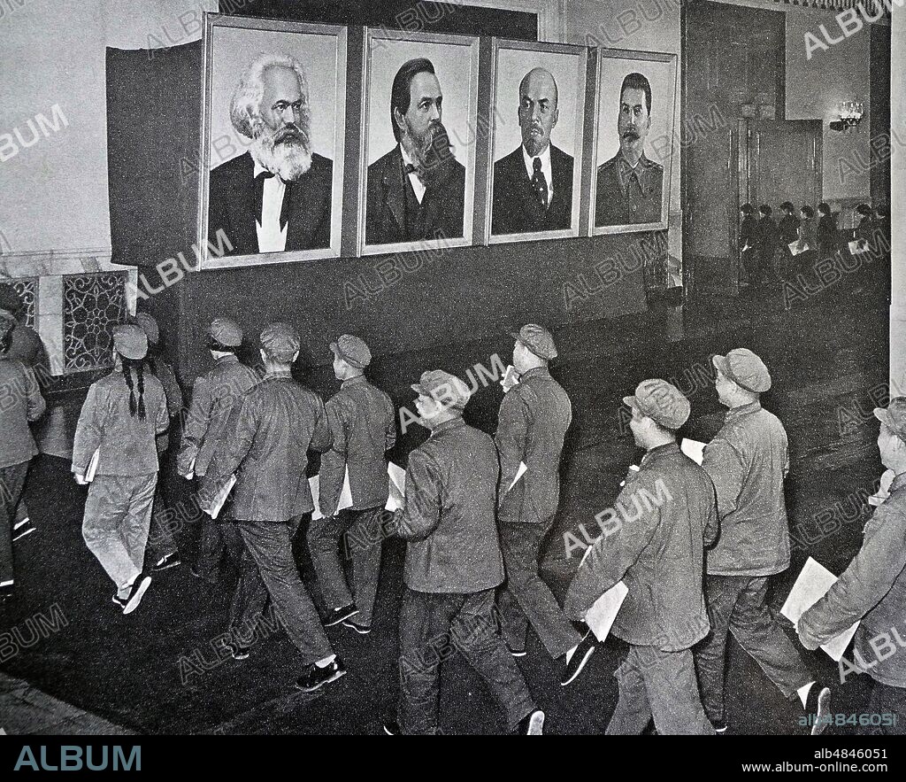 Portraits of Karl Marx, Friederich Engels, Vladimir Lenin and Joseph Stalin greet delegates to a communist party meeting in China 1966.