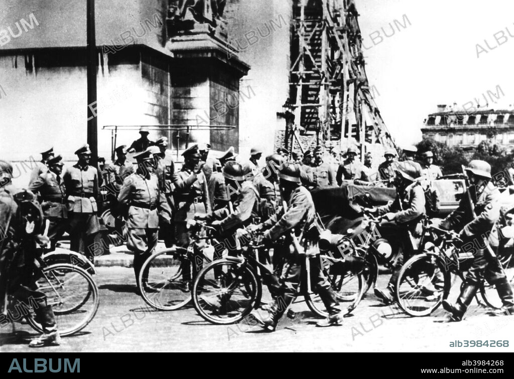 German soldiers marching past the Arc de Triomphe, Paris, 14 June 1940. General Fedor von Bock reviews a parade of the victorious German troops on the day Paris fell to them.