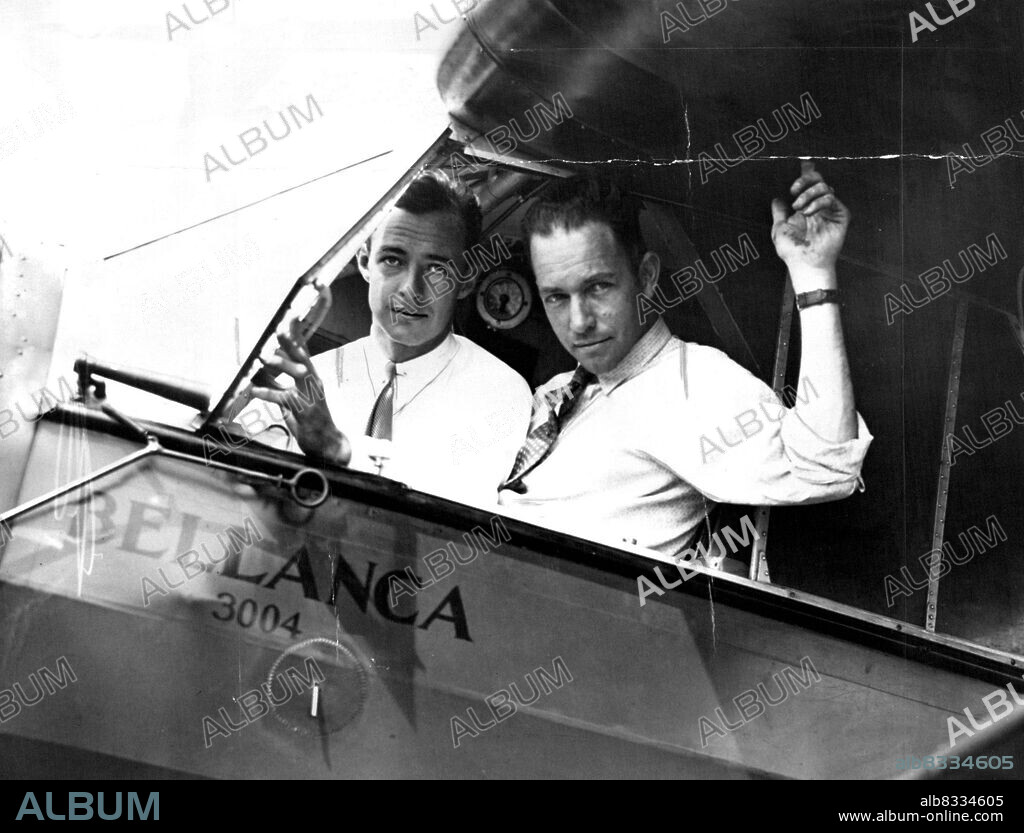 On Your Mark--Get Set --Hugh Herndon, left, and Clyde Pangborn in the Cockpit of their plane all set for their contemplated hop across the Atlantic ocean. They will most likely be the newest members to the exclusive "Ocean-Crossers" club whose ranks have swollen this year in unprecendented fashion. They will try to Gridle the Entire Globe. June 26, 1931. (Photo by International Newsreel Photo).