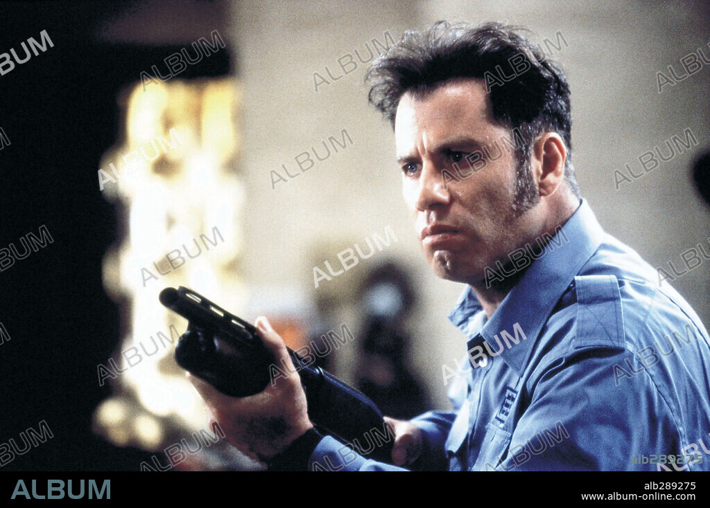 JOHN TRAVOLTA in MAD CITY, 1997, directed by CONSTANTIN COSTA-GAVRAS. Copyright WARNER BROTHERS / CLOSE, MURRAY.