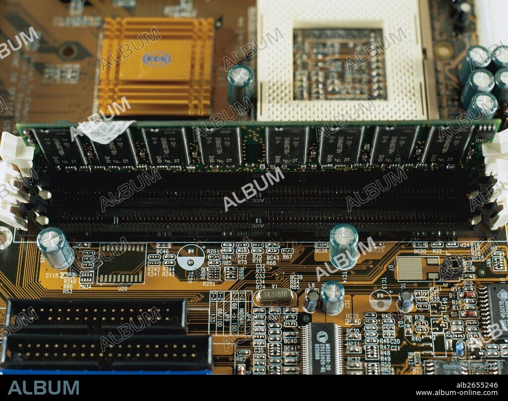 IDE (integrated Drive Electronics). Elongated piece of black color in the center of the image. Ram memory modules are conected on this device.
