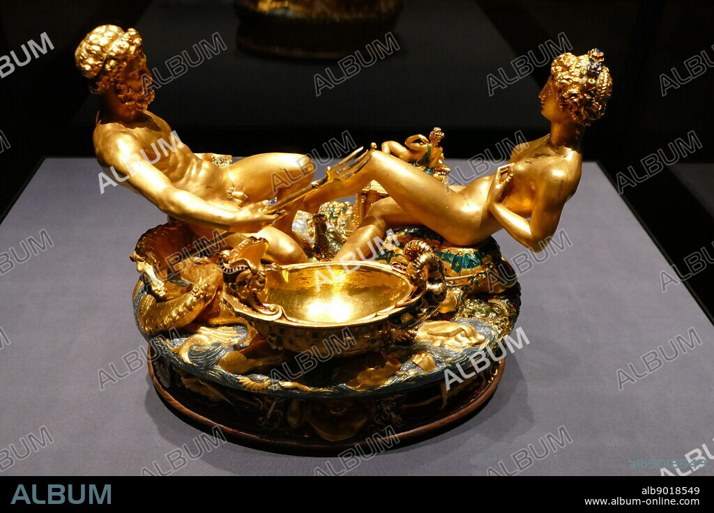 Photograph of the Cellini Salt Cellar (Saliera), a part-enamelled gold table sculpture, by Benvenuto Cellini. It was completed in 1543 for Francis I of France, from models that had been prepared many years earlier for Cardinal Ippolito d'Este. The Cellini Salt Cellar depicts a male figure representing the sea and a female figure that represents the earth. Benvenuto Cellini (1500-1571) an Italian goldsmith, sculptor, draftsman, solider, musician, and artist. Dated 16th Century.