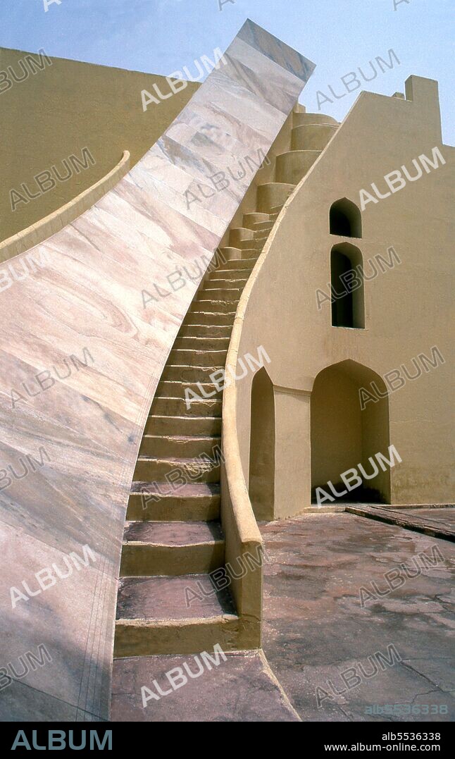 The Jantar Mantar is a collection of architectural astronomical instruments, built by Maharaja Sawai Jai Singh who was a Rajput king. The observatory consists of fourteen major geometric devices for measuring time, predicting eclipses, tracking stars' location as the earth orbits around the sun, ascertaining the declinations of planets, and determining the celestial altitudes and related ephemerides. Jaipur is the capital and largest city of the Indian state of Rajasthan. It was founded on 18 November 1727 by Maharaja Sawai Jai Singh II, the ruler of Amber, after whom the city was named. The city today has a population of 3.1 million. Jaipur is known as the Pink City of India. The city is remarkable among pre-modern Indian cities for the width and regularity of its streets which are laid out into six sectors separated by broad streets 34 m (111 ft) wide. The urban quarters are further divided by networks of gridded streets. Five quarters wrap around the east, south, and west sides of a central palace quarter, with a sixth quarter immediately to the east. The Palace quarter encloses the sprawling Hawa Mahal palace complex, formal gardens, and a small lake. Nahargarh Fort, which was the residence of the King Sawai Jai Singh II, crowns the hill in the northwest corner of the old city. The observatory, Jantar Mantar, is a World Heritage Site.
