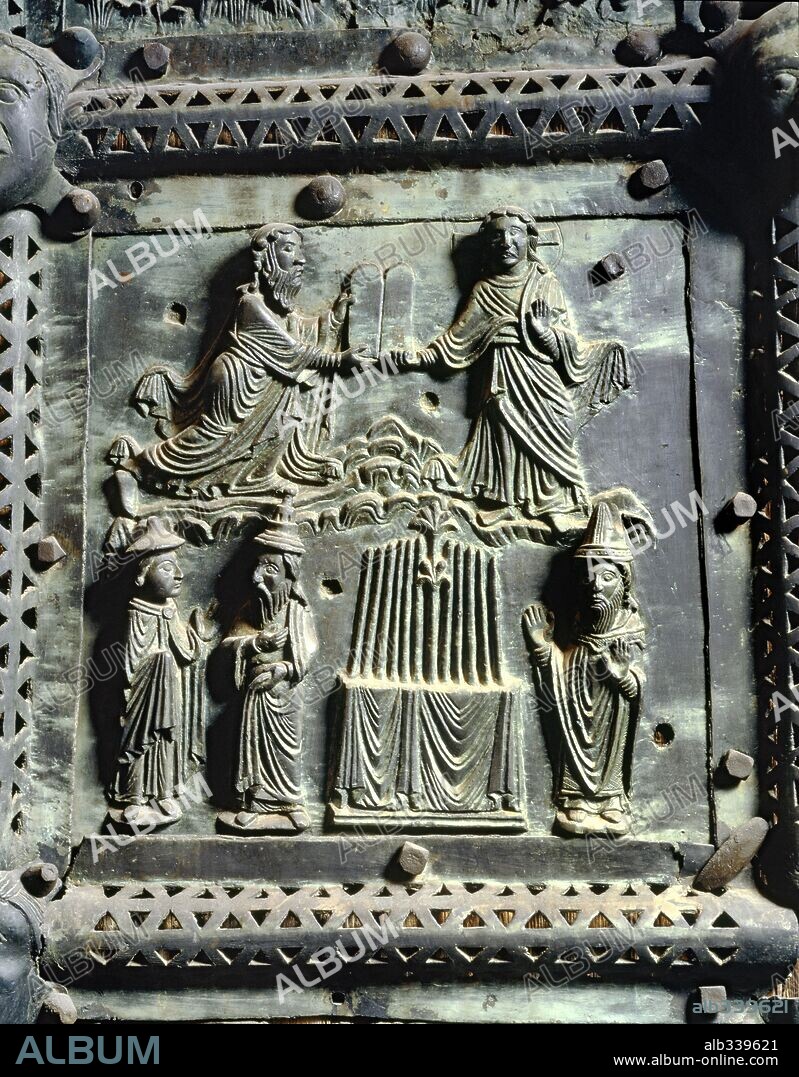 Moses and the tablets of the law and Aaron's rod or staff in ark of covenant flowering, bronze portal XIIth century.