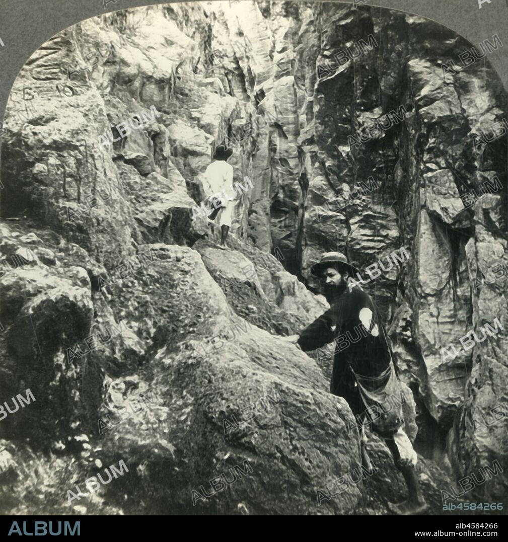 'Mighty Earthquake Fissure - "Lac du Nord". Soufriere Volcano, Guadeloupe, French West Indies', c1930s. La Grande Soufriere is s an active stratovolcano on the French island of Basse-Terre, in Guadeloupe. On February 8, 1843, an eruption caused by an earthquake killed over 5,000 people.  From "Tour of the World". [Keystone View Company, Meadville, Pa., New York, Chicago, London].