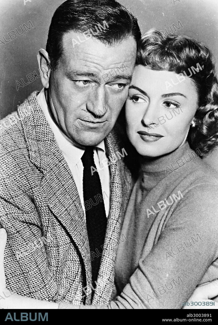 DONNA REED and JOHN WAYNE in TROUBLE ALONG THE WAY, 1953, directed by MICHAEL CURTIZ. Copyright WARNER BROTHERS.
