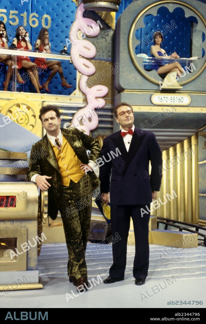 Gene Gnocchi and Paolo Bonolis presenting I cervelloni. Italian TV host Paolo Bonolis and Italian comedian Gene Gnocchi prestnting the TV show I cervelloni. 1994.