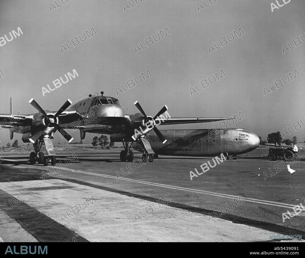 The cargo-carrying fuselage of the revolutionary new Fairchild XC-120 Packplane parked alongside the plane. Detachable quickly and easily, the "pod" can be loaded or unloaded at the convenience of ground crews, freeing the plane itself to pick up another "pod". October 01, 1950. (Photo by Dan Frankforter, Fairchild Aircraft). ;The cargo-carrying fuselage of the revolutionary new Fairchild XC-120 Packplane parked alongside the plane. Detachable quickly and easily, the "pod" can be loaded or unloa.