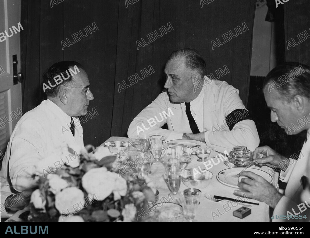 President Getulio Vargas of Brazil confers with President Roosevelt at a conference aboard a U.S. destroyer in the Potengi River harbour at Natal, during World War Two.