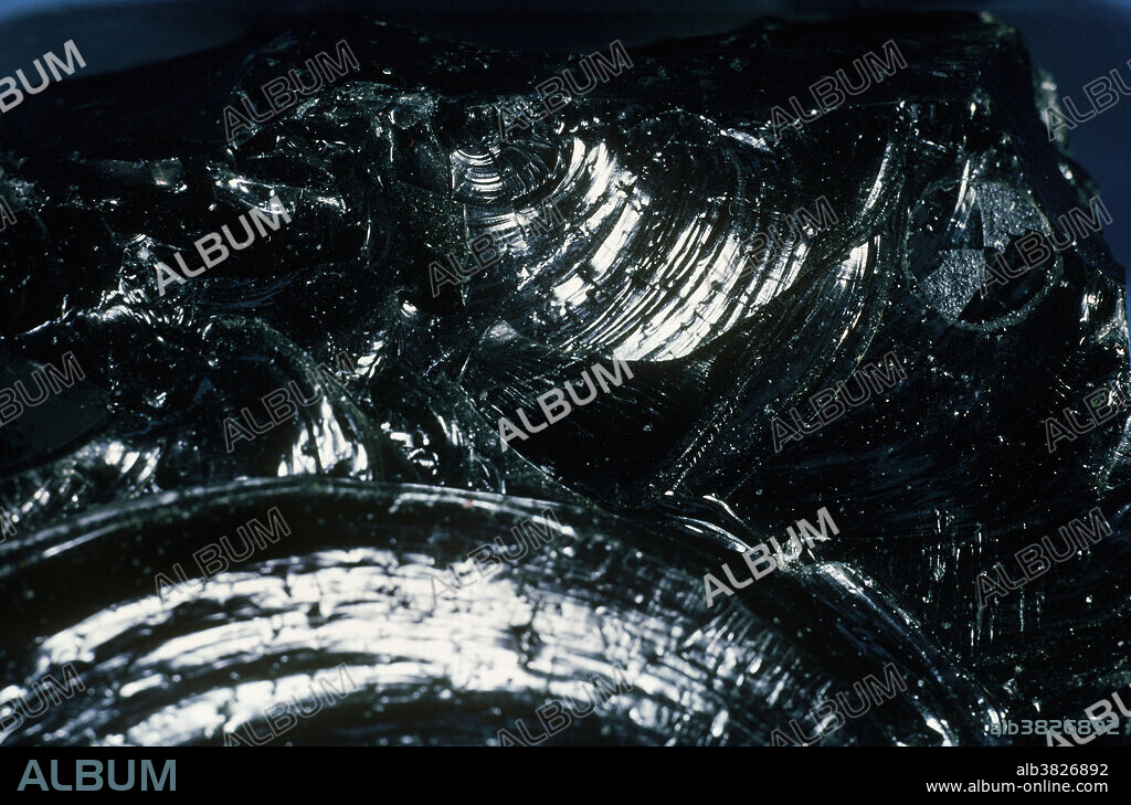 Fracture describes the way a mineral breaks when it does not display cleavage, the tendency to split along specific planes. Fracture is described with terms such as hackly, even, uneven, fibrous, splintery, etc. Conchoidal fracture resembles the curved lines of a clamshell, and is characteristic of the way glass breaks. Obsidian fractures this way because it is volcanic glass.