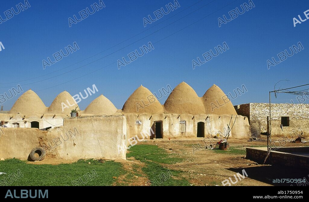 Syrian Arab Republic. Old traditional hive houses adapted to moderate the climatic rigors of the area. Fah village, near Aleppo. Photo taken before the Syrian CIvil War.