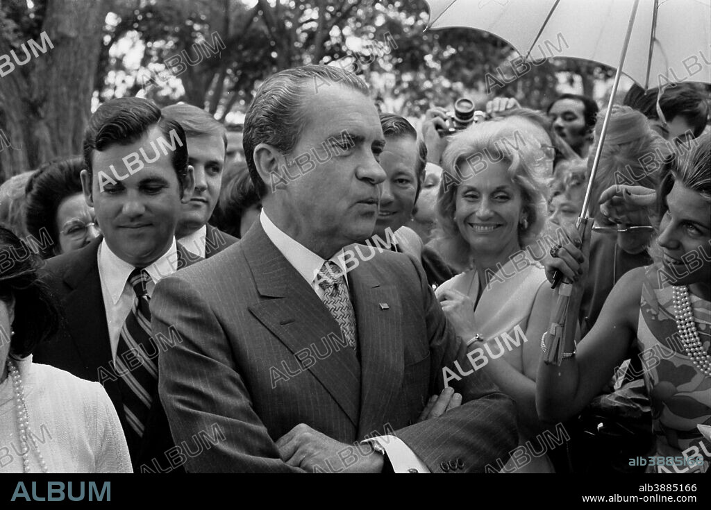 June 12, 1971 - President Richard Nixon standing in a crowd of people at daughter Tricia Nixon's wedding at the White House.