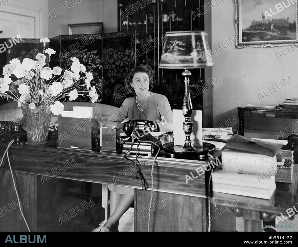 Queen Elizabeth at desk. July 1, 1946. (Photo by Camera Press Ltd.).