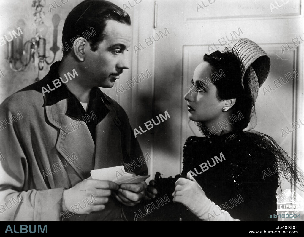 MELVYN DOUGLAS and MERLE OBERON in THAT UNCERTAIN FEELING, 1941, directed by ERNST LUBITSCH. Copyright UNITED ARTISTS.