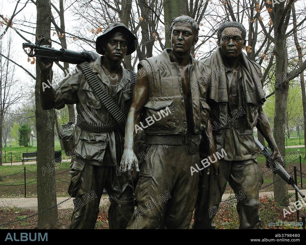The Three Soldiers at the Vietnam Veterans Memorial in Washington, D.C. Adjacent to Maya Lin's memorial, a wall of the names of servicemen killed in the war, is Frederick Hart's "Three Soldiers." The statues, depicting Caucasian, African-American, and Hispanic soldiers, look wistfully towards the wall memorial.