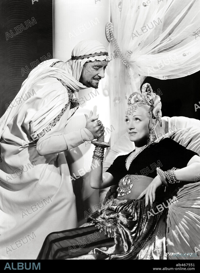 MARLENE DIETRICH and RONALD COLMAN in KISMET, 1944, directed by WILHELM DIETERLE. Copyright M.G.M.
