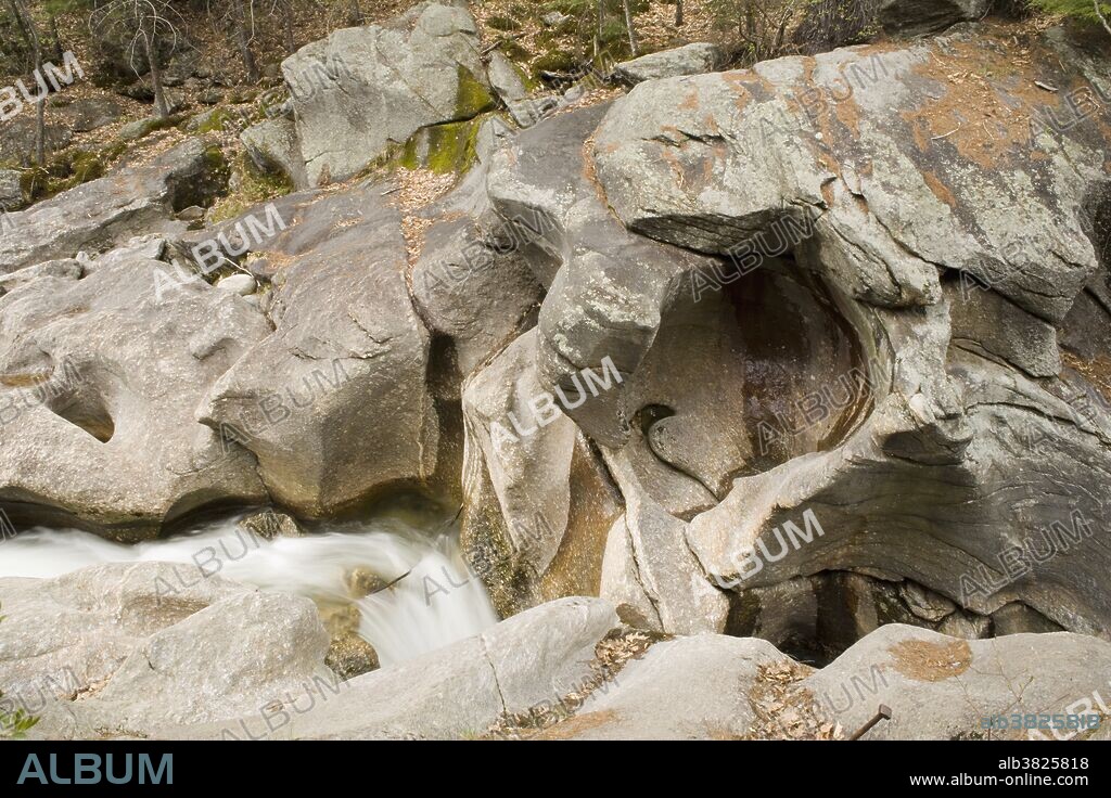 Water erosion and potholes in granite rocks, Sculptured Rocks Natural Area, New Hampshire, USA.