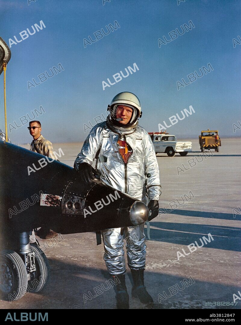 X-15 pilot Armstrong, beside his airplane following a flight at Edwards Air Force Base. Neil Alden Armstrong (August 5, 1930 - August 25, 2012) was an American astronaut and the first person to walk on the Moon. He was also an aerospace engineer, naval aviator, test pilot, and university professor. Before becoming an astronaut, Armstrong was an officer in the US Navy and served in the Korean War. A participant in the US Air Force's Man in Space Soonest and X-20 Dyna-Soar human spaceflight programs, Armstrong joined the NASA Astronaut Corps in 1962. He made his first space flight, as command pilot of Gemini 8, in 1966, becoming NASA's first civilian astronaut to fly in space. On this mission, he performed the first docking of two spacecraft, with pilot David Scott. His second and last spaceflight was as mission commander of the Apollo 11 moon landing, in July 1969. On this mission, he and Buzz Aldrin descended to the lunar surface and spent two and a half hours exploring, while Michael Collins remained in lunar orbit in the Command Module. Along with Collins and Aldrin, he was awarded the Presidential Medal of Freedom by President Richard Nixon. In 1978, President Jimmy Carter presented Armstrong the Congressional Space Medal of Honor in and his former crewmates received the Congressional Gold Medal in 2009. He died in 2012, at the age of 82, after complications from coronary artery bypass surgery.
