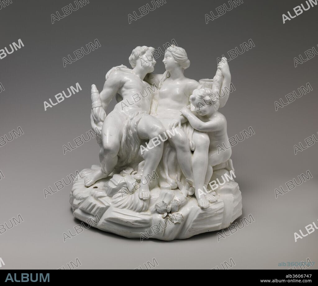 PROBABLY BASED ON A COMPOSITION BY FRANÇOIS LEMOYNE. Hercules and Omphale. Artist: Probably based on a composition by François Lemoyne (French, Paris 1688-1737 Paris). Culture: French, Vincennes. Dimensions: Overall: (confirmed): 8 7/8 × 9 13/16 × 9 3/8 in. (22.5 × 24.9 × 23.8 cm). Factory: Vincennes Manufactory (French, ca. 1740-1756). Date: ca. 1749.
This figure group must have been one of the earliest produced at Vincennes, and the technical difficulties encountered are obvious.  The thickness of the porcelain has caused the seated figures to sag and cracks to appear in the base.  The composition of the group derives from a print made after François Lemoyne's painting of Hercules and Omphale of 1724.