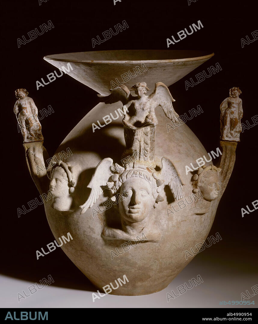Tomb from Canosa with appliquéd decoration in the form of women's heads, a winged Aphrodite, pomegranates and two eros., Vase, urn, burial vase, pottery, South-Italian, Canosa, 49.3 cm, hellenistic 315-300 BC , Italy, Italy.