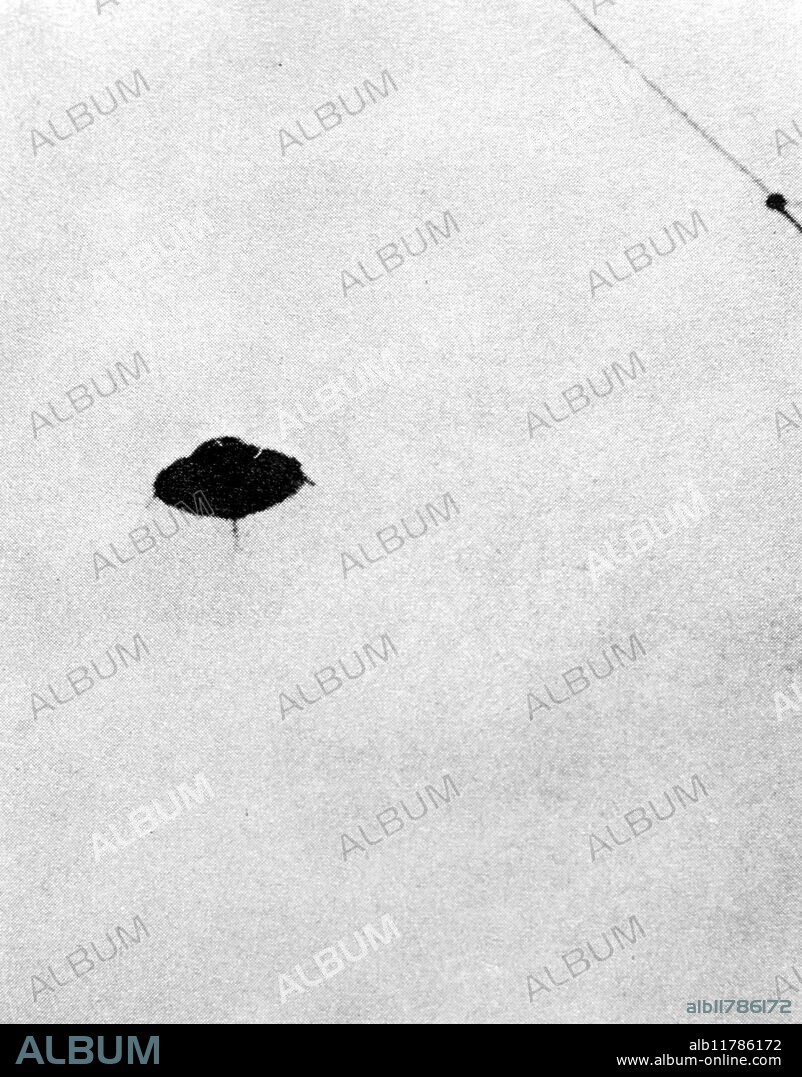 Radio Officer T. Fogl photographed a UFO from the bridge of the SS Ramsay off San Pedro, California, in December 1957. The disc was at first a mile away, but when it came closer he got two photographs. It had a flat dome, a tripod protuberance on its underside, and was silver and black. He later confessed to a hoax: the UFO was a model made from parts of an aeroplane kit. - ©TopFoto / Fortean.
